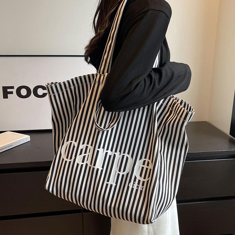 大容量条纹托特包包女2024新款潮休闲文艺单肩帆布包敞口环保布袋