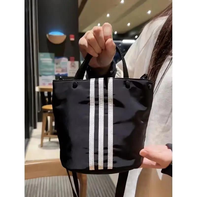 小众三条杠手提包休闲百搭水桶包新款小拎包单肩斜挎包女手拎包