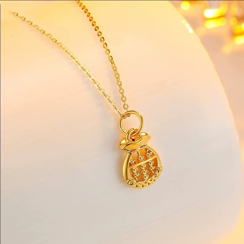 【老凤祥】999足金时尚百搭灵动精美双面镂空钱袋算盘吊坠*芯.芯